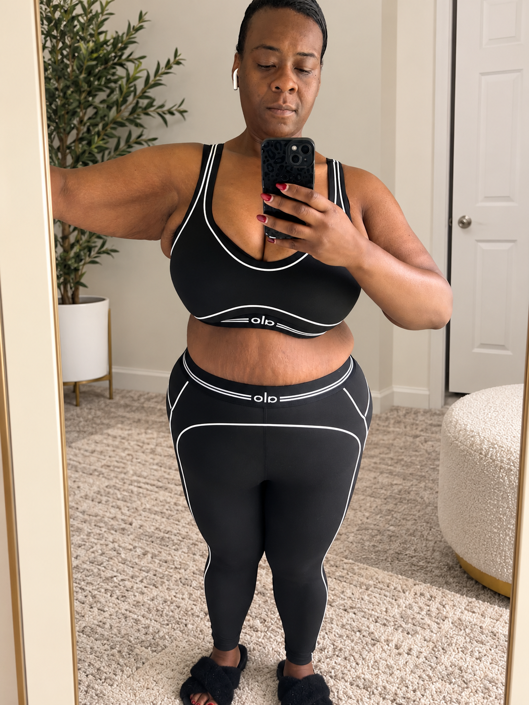 Lucy in her black workout outfit